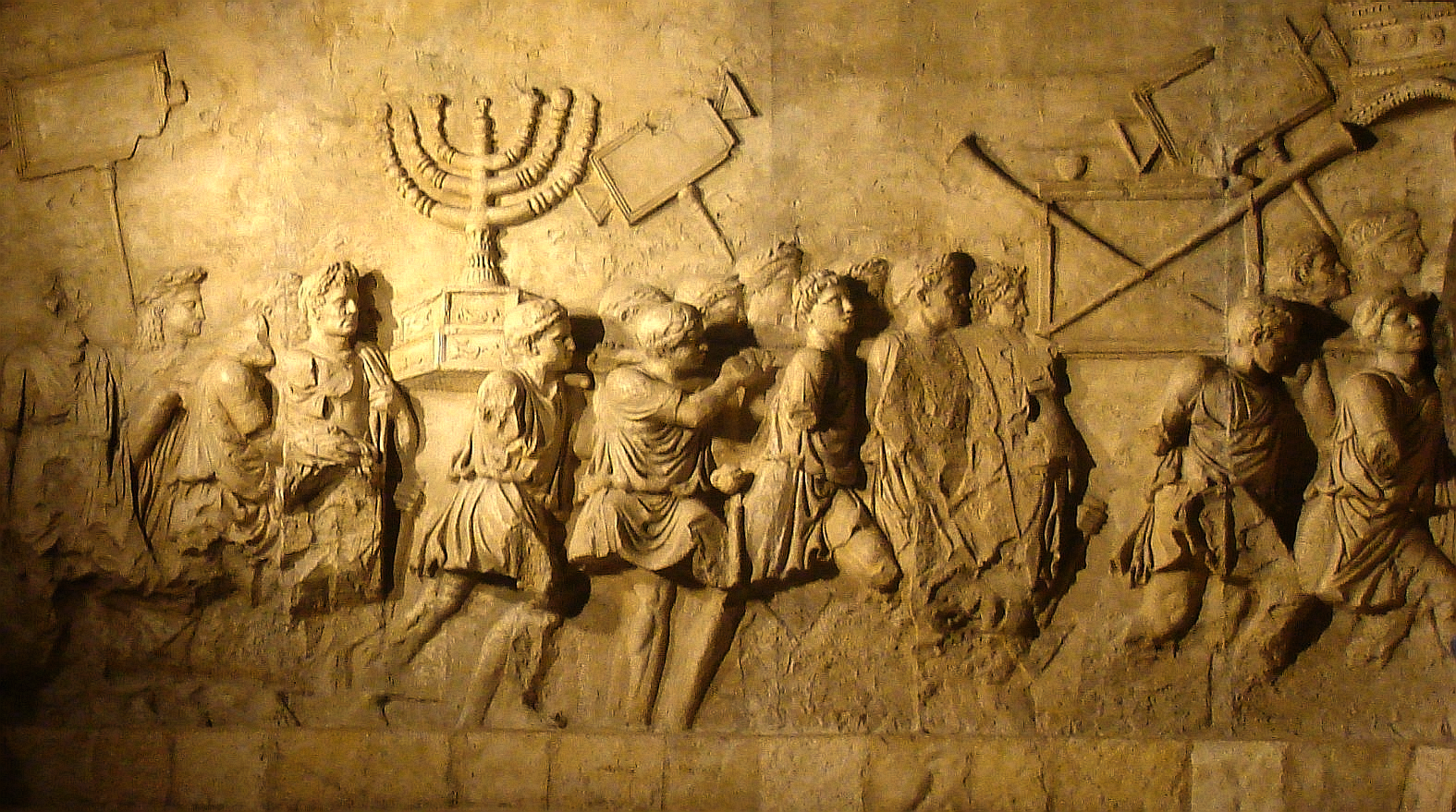 The Arch of Titus menorah relief — the Temple vessels Hebrews catalogs (Heb 9:1-5).